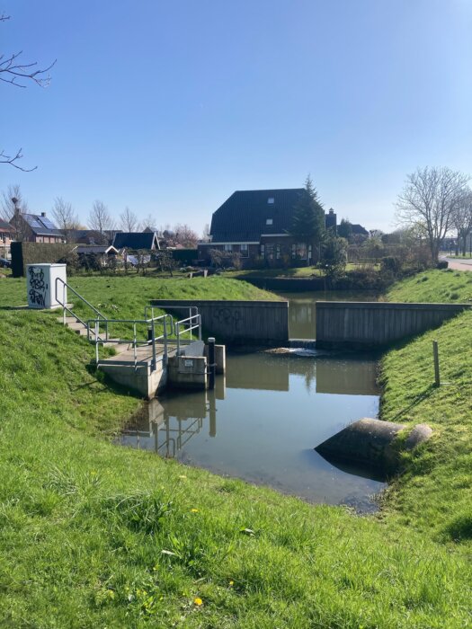 Urban drainage in practice: A culvert, a weir and a pumpstation together showing complexity of urban drainage design